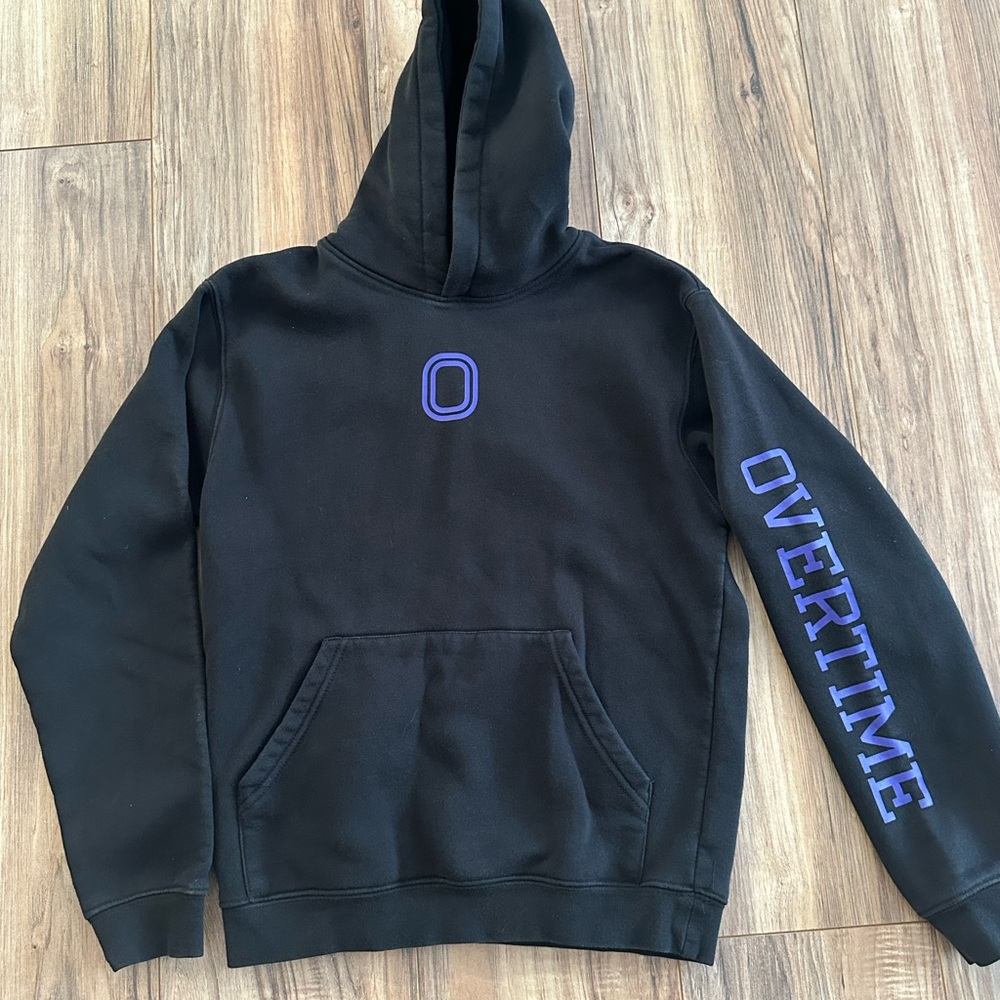 Black “Overtime” hoodie with purple writing. Youth Large